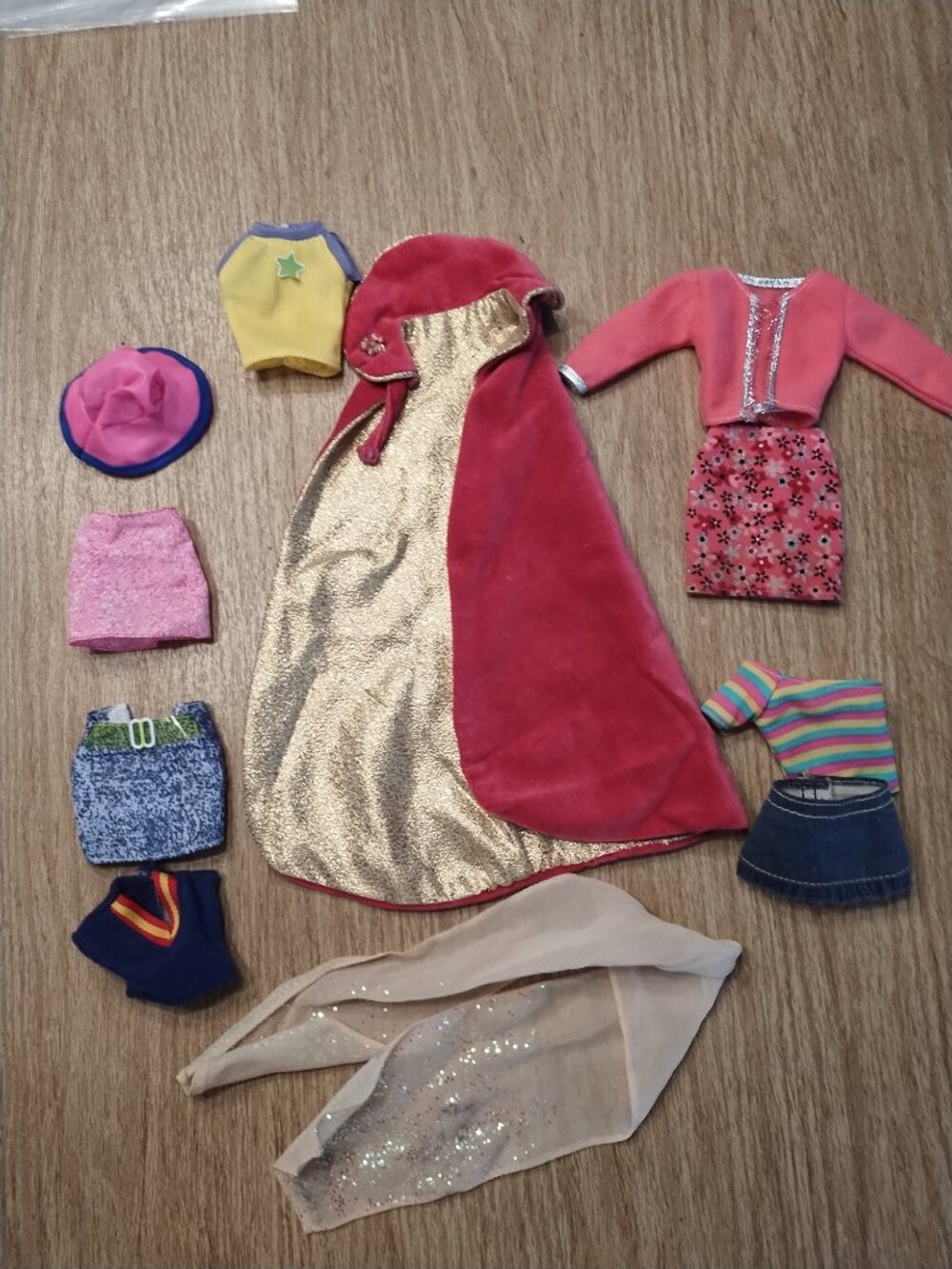 Assorted Barbie clothing and shoes